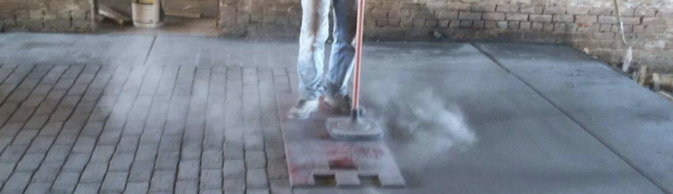Westbrook's craftsman stamping out a pattern on freshly poured concrete..